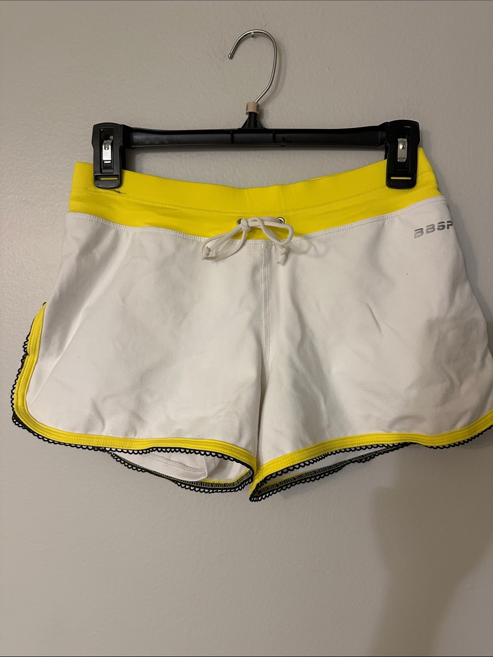 bebe White Athletic Shorts with Yellow Trim